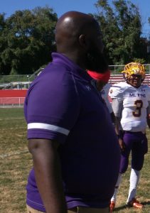 Edward Dunn (263) watches as his defensive unit warms p before Monday's game.